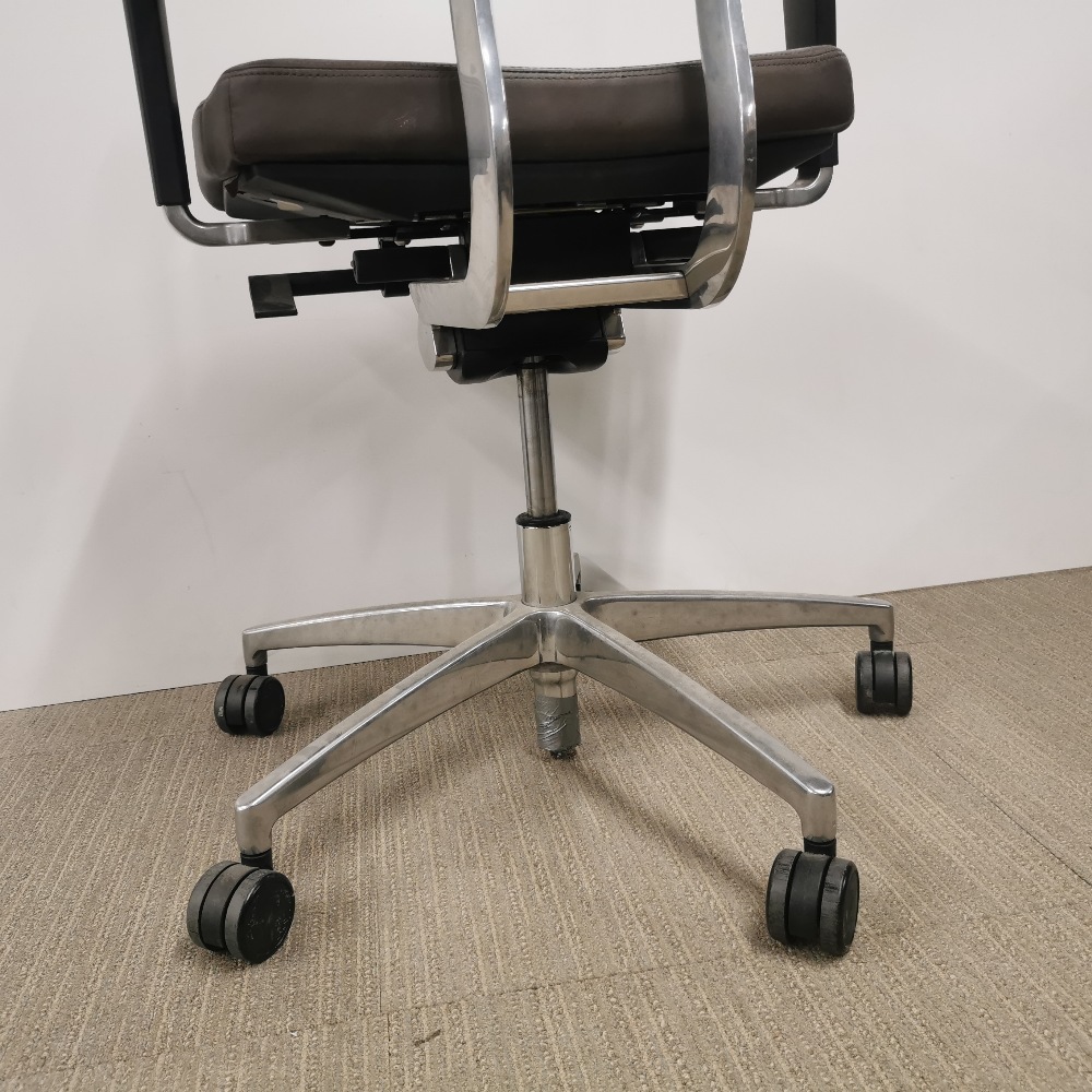 An adjustable faux leather and chrome revolving desk chair. - Image 3 of 4