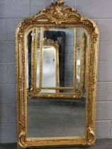 A large giltwood and gesso wall mirror, 158 x 88cm.