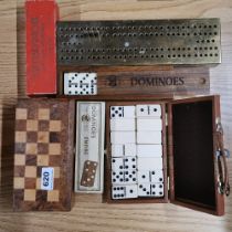 A group of vintage dominoes and other games.