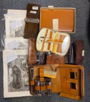 A group of gentlemen's travelling sets and prints.