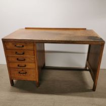 A light oak five drawer writing desk, 120 x 73 x 60cm.