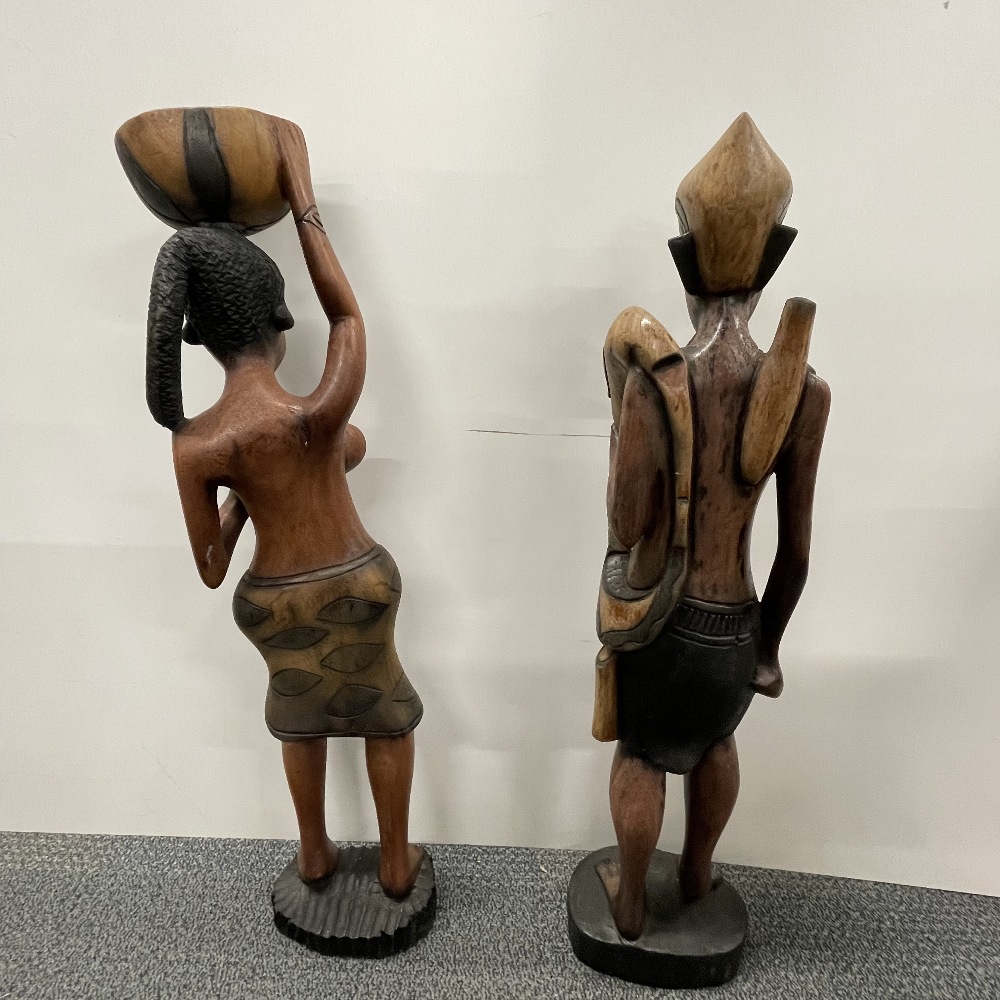 Two large African carved wooden figures with a wooden spear, figure H. 78cm. - Image 4 of 6