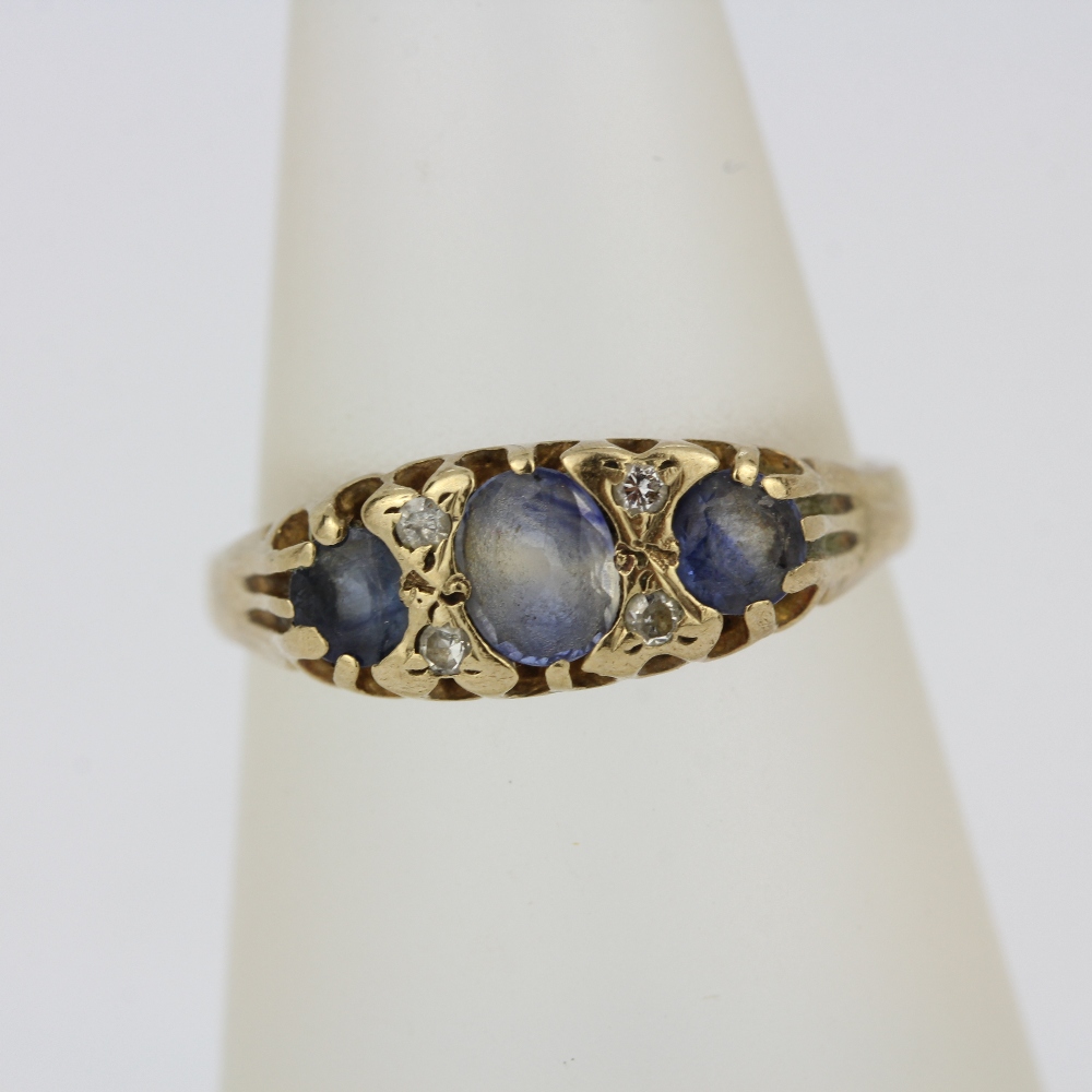 A yellow metal (tested minimum 9ct gold) ring set with ceylon sapphires and diamonds, (O). - Image 3 of 3