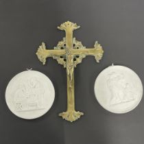 An early 20th century brass crucifix , H. 30cm, together with two Royal Copenhagen plaques.