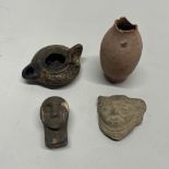 Antiquities interest. A group of four early pottery items, tallest 9cm.