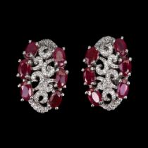 A pair of 925 silver earrings set with rubies and white stones, L. 1.4cm.