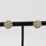 A pair of 18ct white gold cluster stud earrings set with brilliant cut diamonds, approx. 1ct