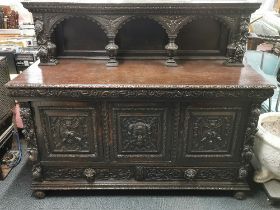 A 19thC carved oak two drawer sideboard/ court cupboard, with ornately carved relief decoration, 170