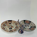 Two Japanese Imari porcelain chargers, Dia. 31cm. Together with two further small Imari porcelain