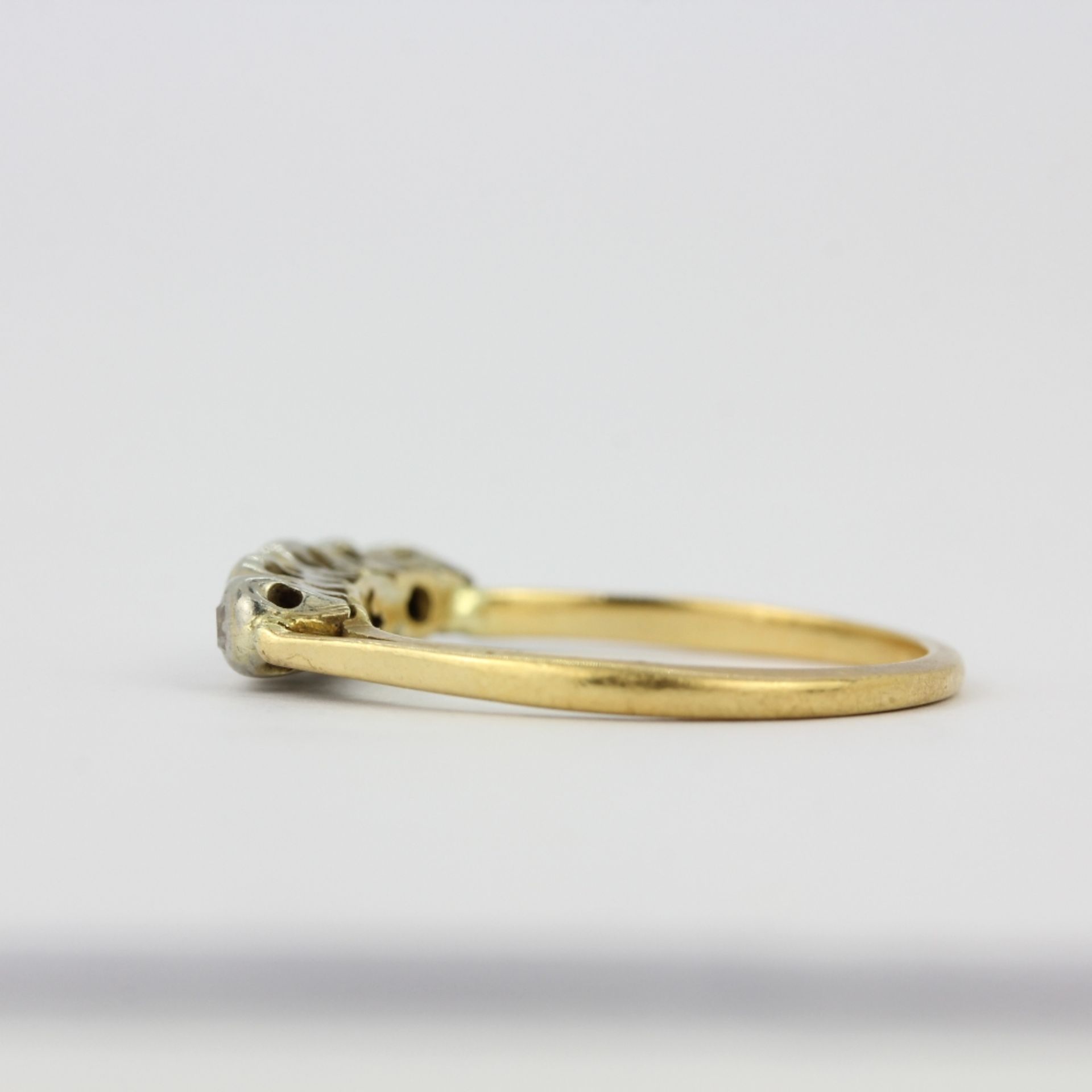 A yellow and white metal (tested minimum 9ct gold) diamond set ring, (M). - Image 2 of 2