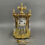 A gilt brass and crystal mercury pendulum mantle clock, H. 42cm.