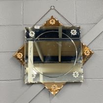 An original Art Deco peach and clear glass mirror, W. 65cm.