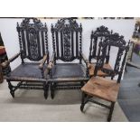 A pair of large carved and turned oak dining carver chairs/ hall chairs together with a further pair