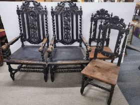 A pair of large carved and turned oak dining carver chairs/ hall chairs together with a further pair