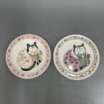 A pair of painted cat plates from a design by John De Bethel, Dia. 27cm.