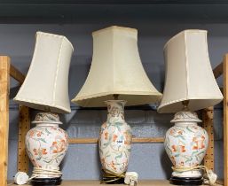 Three Chinese porcelain table lamps and shades, tallest H. 60cm.