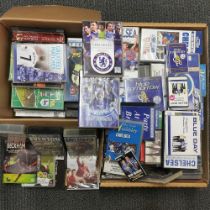 Two boxes of football related videos and DVDs.