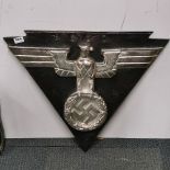 A large metal German reproduction wall insignia, W. 66cm H. 56cm.