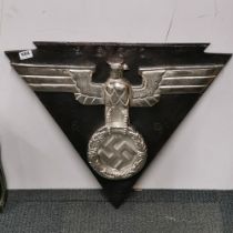 A large metal German reproduction wall insignia, W. 66cm H. 56cm.