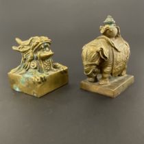 A Chinese bronze elephant scholars seal, H. 9.5cm. Together with a further dragon seal.