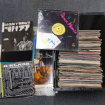 A large quantity of mixed rock, pop and other LP records. Box not included.