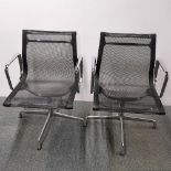 A pair of revolving Eames Vitra type chrome desk chairs, H. 82cm.