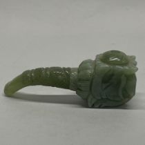 A Chinese carved jade / hardstone opium pipe with screw in detachable bowl, L. 12cm.
