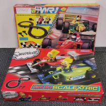 A Scaletrix Simpsons Micro racing set and a MR1 racing set.