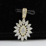 A 10ct yellow gold (marked 10K) diamond set pendant, L. 2.3cm.