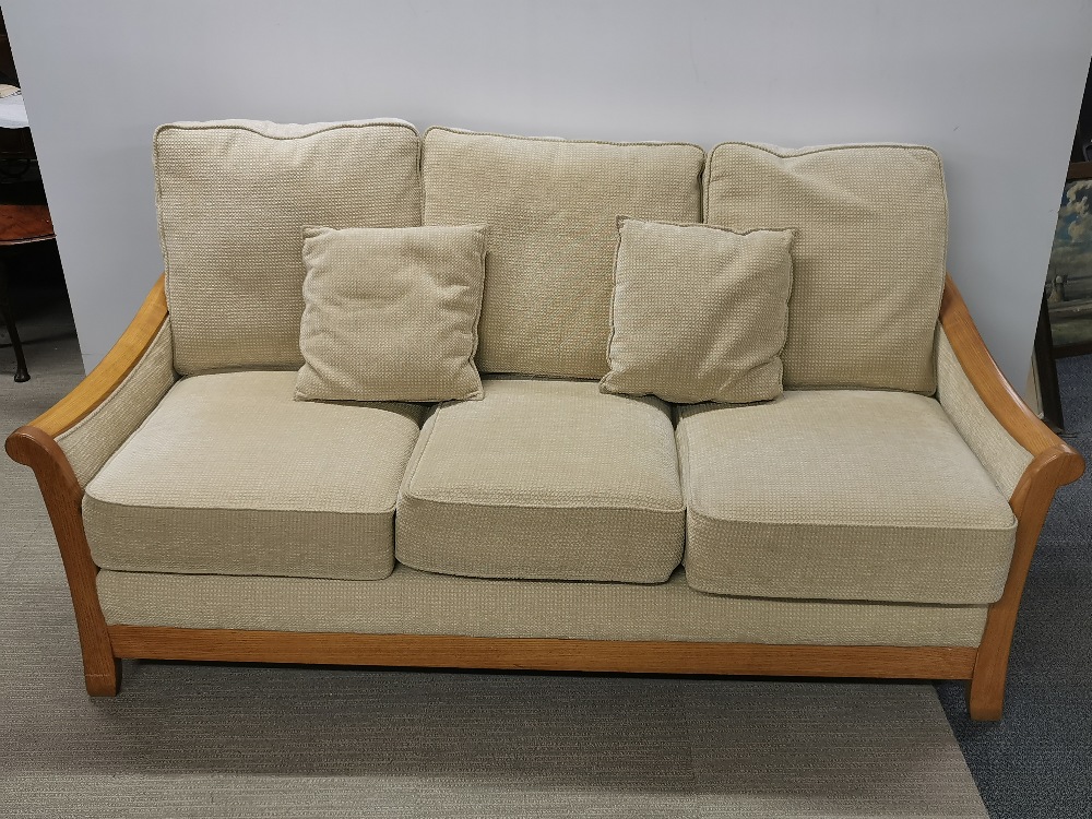 A light oak framed Gplan style three seater settee, L. 190cm H. 95cm W. 95cm.