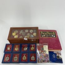 A cased pocketwatch collection with collector's folder and a group of commemorative coins.