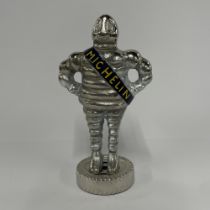 A metal advertising figure, H. 27cm.