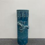 A large Chinese glazed ceramic umbrella stand, relief decorated with a dragon. Some chipping