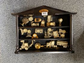 A cased collection of miniature clocks.