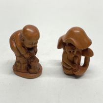 A small Chinese carved fruitwood netsuke of a monkey and mushrooms, together with a netsuke of a