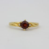 A hallmarked 18ct yellow gold ring set with a hexagonal cut tourmaline, (O.5).