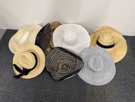 A quantity of vintage ladies wide brimmed hats.