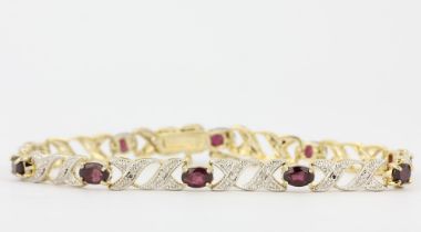 A silver gilt bracelet set with oval cut tourmalines and small diamonds, L.