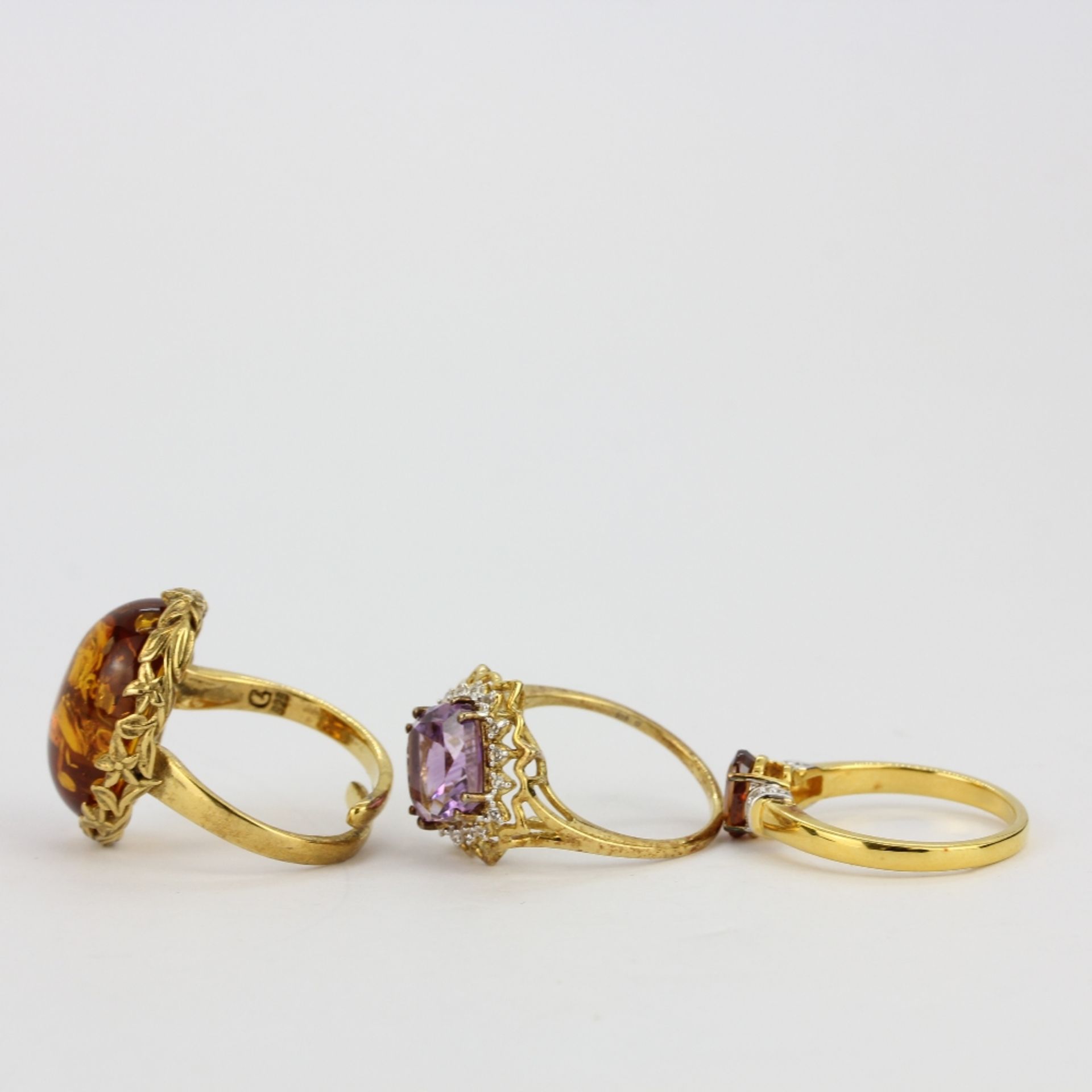Three 925 silver gilt stone set rings including amber, amethyst and citrine. - Image 2 of 2