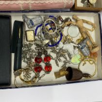 A Victorian photograph album with a quantity of small interesting items.