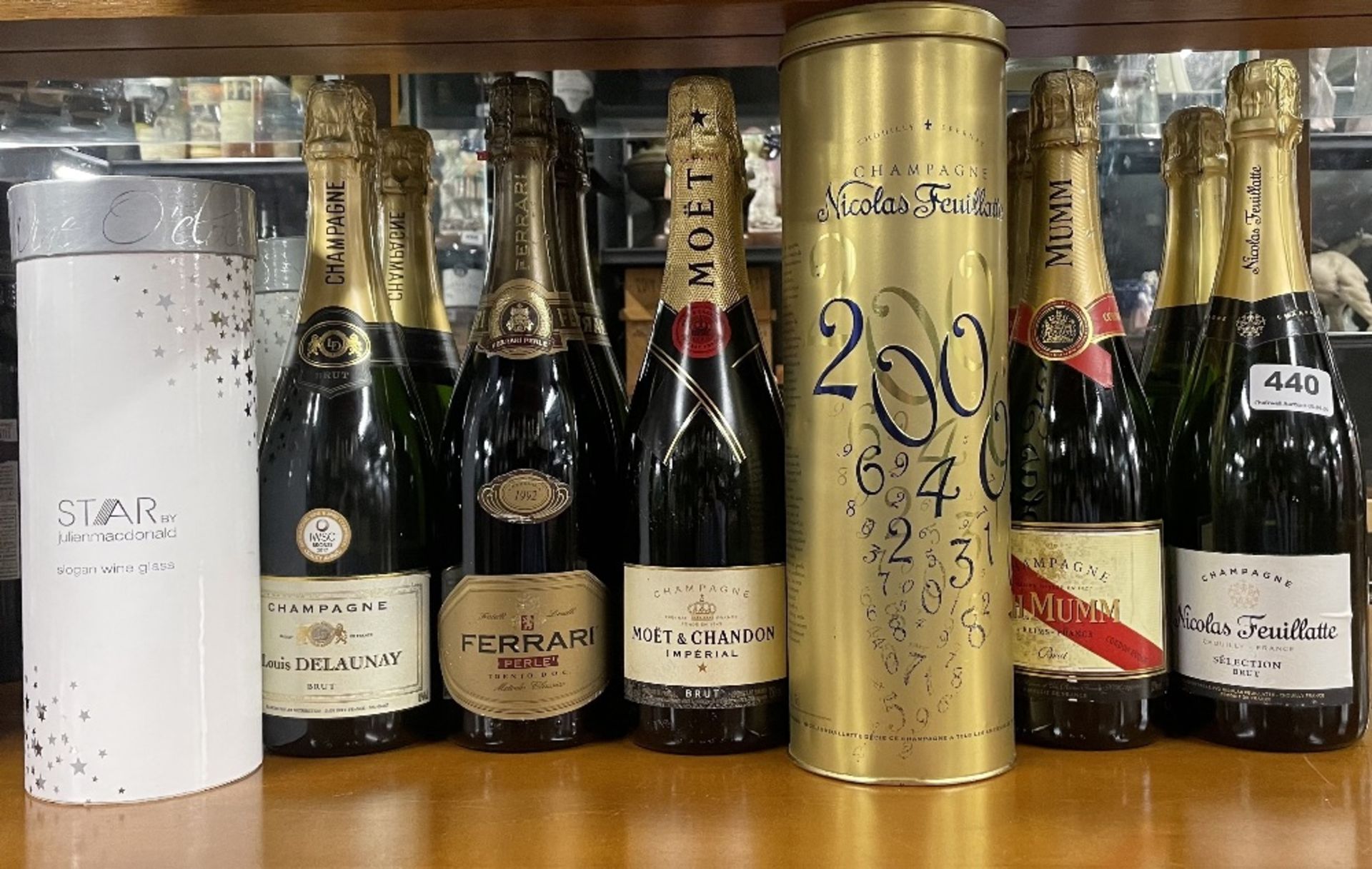 Six mixed bottles of champagne with a boxed decorative wine glass.