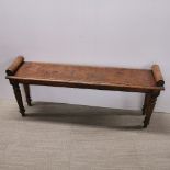 An early 20thC scroll end oak hall bench, 122 x 52 x 28cm.