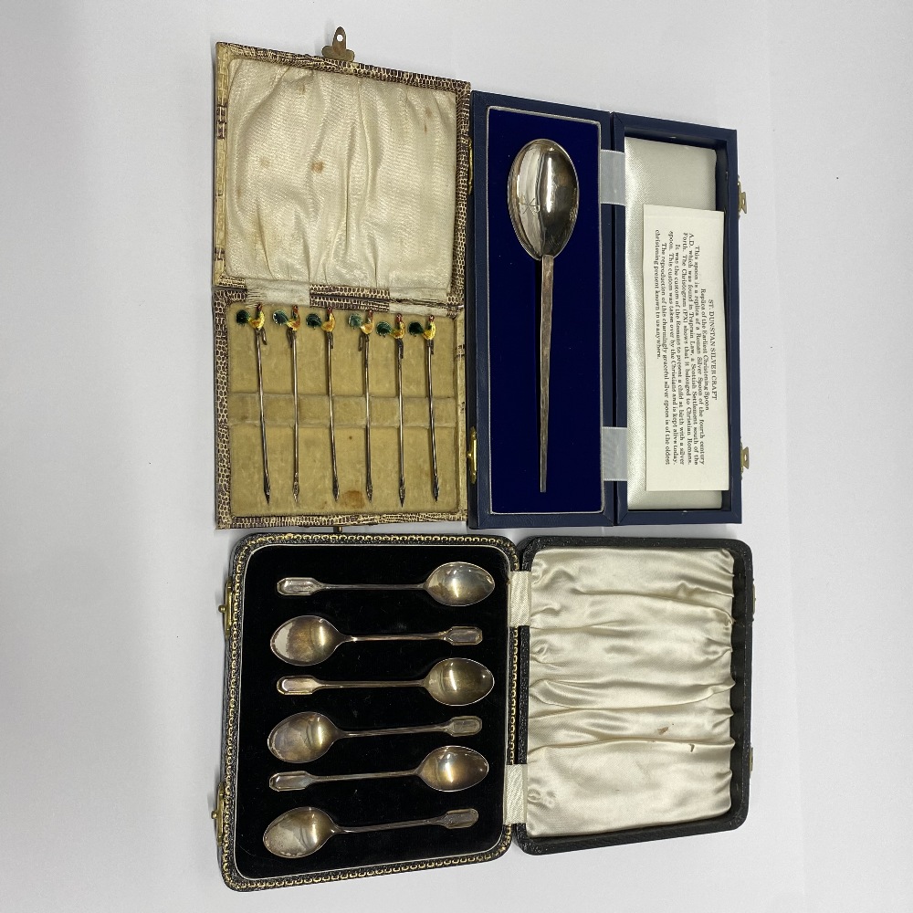 Three cases of hallmarked silver cutlery items.