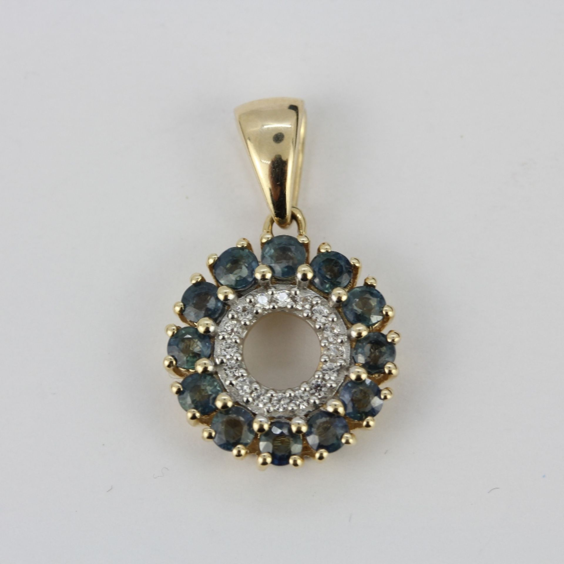 A 10ct yellow gold (stamped 10K) pendant set with London blue topaz and diamonds, L. 2cm. - Image 2 of 3