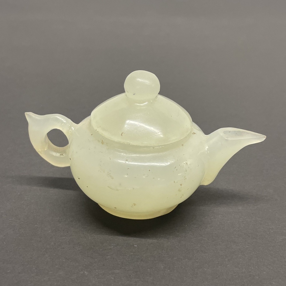 A Chinese carved jade / hardstone tea pot, H. 9cm.