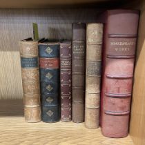 Six leather bound volumes of literature.