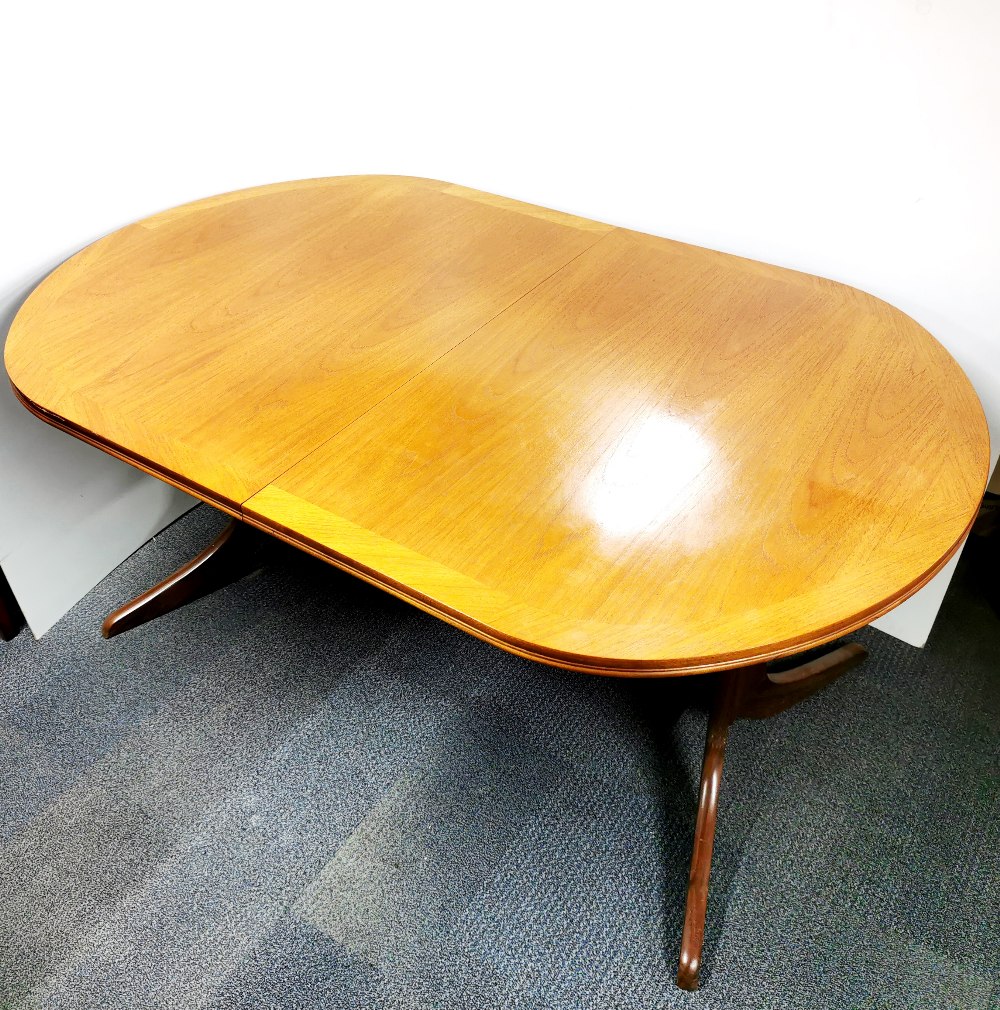 A 1970's Nathan extending teak dining table, H. 73.5cm, W. 104cm. Unextended L. 164cm, extended L.