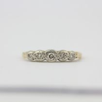 A yellow and white metal (tested minimum 9ct gold) diamond set ring, (M).