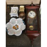 A wall clock, a porcelain mantel clock and three other items.