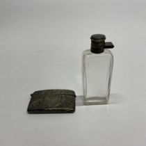 A hallmarked silver visiting card case, W. 8cm, together with a silver topped spirit flask.